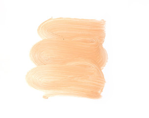 Bronze makeup smear isolated on white background. Liquid foundation makeup texture. Foundation strokes or liquid powder on a white background.