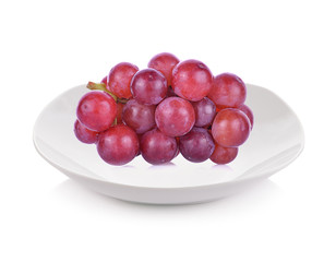 Grape on plate isolated on white background.