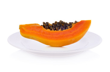 Papaya fruits on plate isolated on white background.