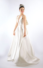 Fototapeta premium Beautiful woman brunette hair perfect skinny body wear fashion long dress for party wedding dress bride natural model with natural makeup style for celebrity and red carpet gray background. Isolated