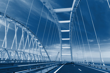 the Car rides on the road bridge connecting the banks of the Kerch Strait between Taman And Kerch
