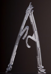 two transparent clothes hangers leaning on each other against grey background