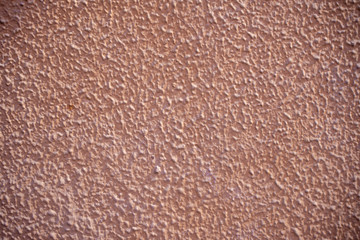 Rough wall stucco texture. Facade relief painted salmon.