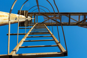 Technical ladder on the overpass, view from below.