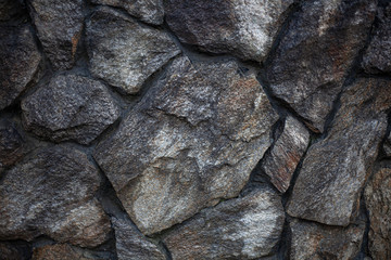 Masonry texture. Background of stones. Part of the wall. The design of the fence. Rough rough stone. Blank for the design of the fence.