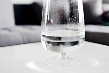 glass with water and tablet,hand throwing pill into a tank with water,cold medicine,strengthening immunity and health,vitamin pill,glass of water