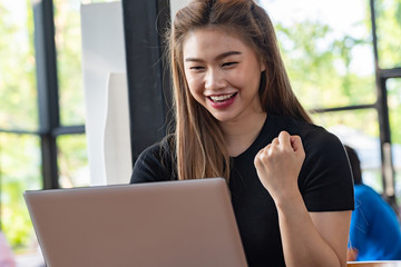 Beautiful Attractive Asian woman working with computer laptop and thinking to get ideas and requirement in Business startup feeling so happiness,Business Startup Concept