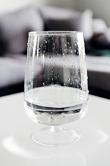 glass with water and tablet,hand throwing pill into a tank with water,cold medicine,strengthening immunity and health,vitamin pill,glass of water