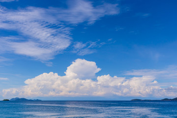 Naklejka na ściany i meble Blue sky with white cloud and deep blue sea