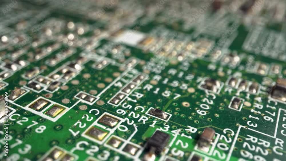 Poster extreme close-up of green printed circuit board electronics inside smartphone shot with dolly slider