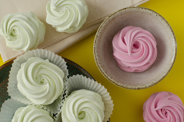 marshmallow on dish on yellow background. Marshmallow in cup. Marshmallow on linen.