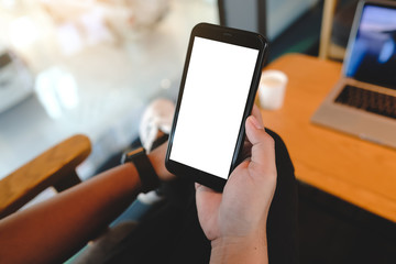 Close up of man using cell phone,sending massages on the coffee shop with black screen,texting,video calls.