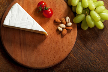 Expensive elite cheese on a wooden background