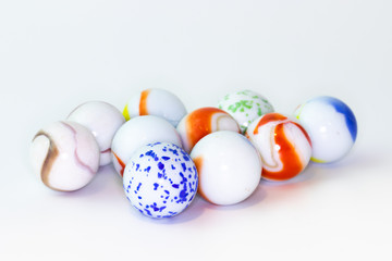 Colourful glass marbles isolated on white background.