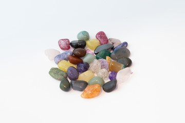 Bright colorful natural stones on a white background