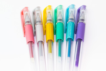 Set of color plastic gel pens with metallic colors, isolated on white background