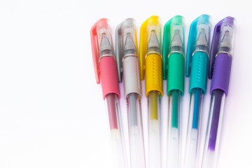 Set of color plastic gel pens with metallic colors, isolated on white background