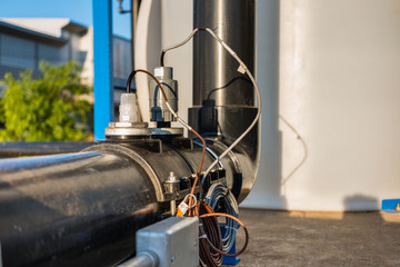 Electrical meter measuring chlorine and Ph in water supply pipe.selective focus.