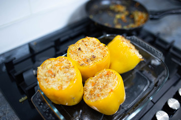 stuffed yellow peppers with rice in the oven.