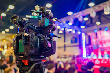 The professional camera is aimed at the scene. Professional camera on a tripod. Camera for video...