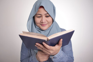 Muslim Woman Reading Book, Smiling