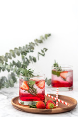 Summer strawberry drink on marble white background.