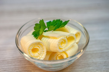 Butter parsley with butter on a wooden table in a bowl