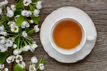 Tea mug and apple flowers