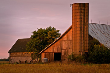 Warm sunset light on the side of a weather Midwest barn. © Mark Baldwin