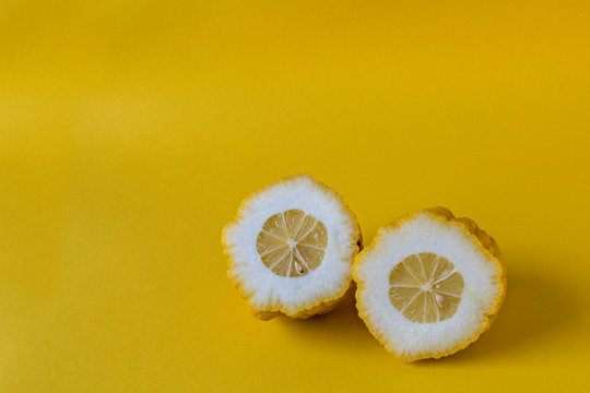 A citron fruit halved