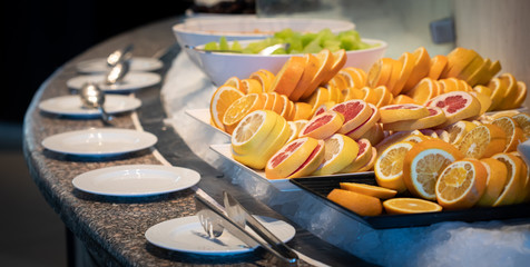 Cut oranges and grapefruits in buffet
