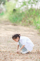 Asian little boy and girl in a doctor suit in Garden