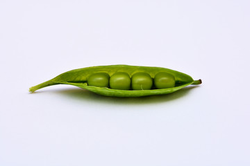 Fresh open green peas isolated on a white background
