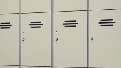 School or gym lockers - pan over different storage boxes - Powered by Adobe