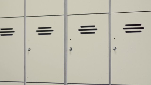 School or gym lockers - pan over different storage boxes