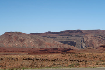 Fototapeta na wymiar Landscape of barren colorfully striped hills in Southern Utah