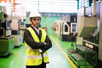 Waist up factory manager at manufacturing room
