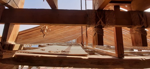 The frame of a wooden roof made of dried wooden beam