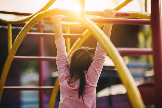 School kids play and learn in the playgound. Physical activity like climbing are good for develop movement and muscle in children and improve brain in multifunctions from playing activities.