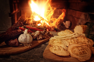 grilled delicious food - sausage, garlic and highland smoked cheese