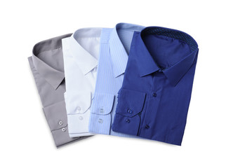 Stylish shirts isolated on white, top view. Dry-cleaning service