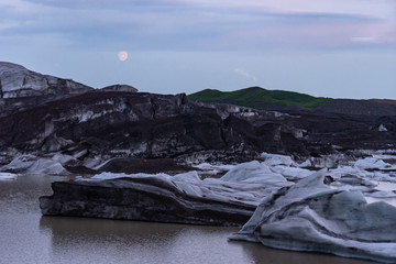 Beautiful night, Icelandic landscape with Glacier, ash and moon above 