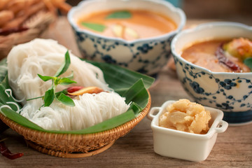 The Siam cuisine concept : soft noodle with red curry soup or Kanom Jeen is Thai vintage food culture 