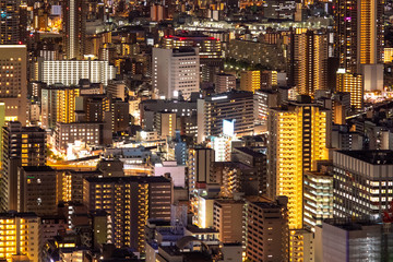 Japan. Osaka. Panorama of night Osaka top view. Background from night high-rise buildings with a burning light. Overnight in a Japanese city. Japan urban. Background - night in the metropolis