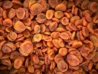 Dried apricot fruit forming a background