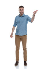 Amazed casual man smiling and explaining