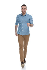 Fototapeta premium Cheerful casual man smiling while wearing blue shirt