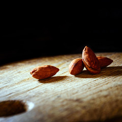 Almonds on the wooden background