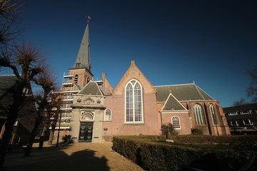 Reformed church in reconstruction in the sun at the old town center of Voorburg