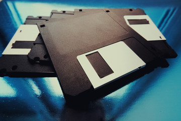 Fototapeta premium A computer floppy disk. An old magnetic media. Vintage computers.Old magnetic media.